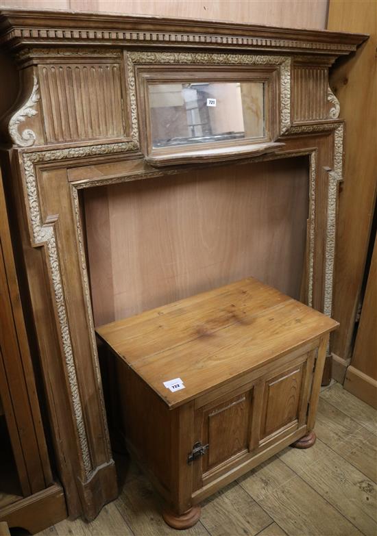 A pine fire surround with mirror inset, W.127cm